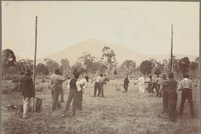 Photograph of Aboriginal men playing football in a paddock at Coranderrk Aboriginal Station, Victoria, 1904.|700x467