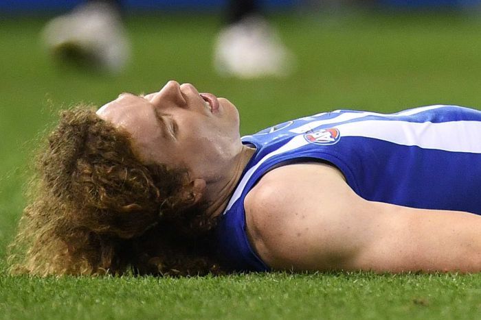 Ben Brown lies unconscious on the turf.|700x467